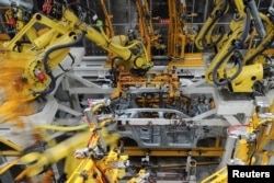 FILE - A view inside the Dongfeng Peugeot Citroen factory before it starts up production in Chengdu, Sichuan province, China, Sept. 6, 2016.