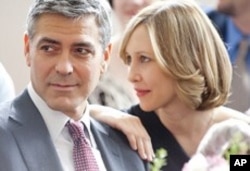 George Clooney and Vera Farmiga in scene from Up In The Air