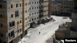 Гута, Дамаск. На снимке – один из жителей города, пострадавший в результате химической атаки 21 августа 2013 г. (архивное фото) 