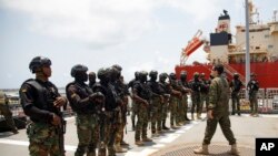 FILE - Ghanaian soldiers receive instructions from a Dutch soldier during Flintlock 2023 on a Spanish frigate at Tema port, Ghana, March 9, 2023.