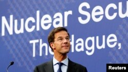 Dutch Prime Minister Mark Rutte is seen at a news conference on the eve of a Nuclear Security Summit in The Hague March 23, 2014.