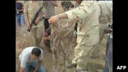 Qeveria kalimtare në Libi thotë se ka zbuluar një varrezë masive