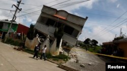 An earthquake-damaged house is pictured in the San Marcos region, in the northwest of Guatemala, July 7, 2014. 