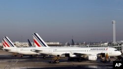 FILE - Air France planes are parked on the tarmac at Paris Charles de Gaulle airport, in Roissy, near Paris, Feb. 7, 2012. 