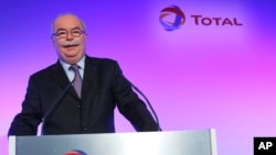 FILE - This Feb. 13, 2013 file photo shows French energy giant Total CEO, Christophe de Margerie, posing prior to a press conference in Paris, France. 