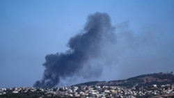 Asap mengepul dari Lebanon selatan menyusul serangan Israel, di tengah permusuhan lintas batas antara Hizbullah dan Israel, terlihat dari Israel utara, 8 Oktober 2024. (Ayal Margolin/REUTERS)