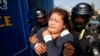 A protester is detained during an attempt to deliver a petition, near the French embassy, in Phnom Penh January 21, 2014.