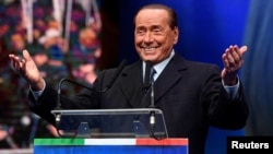Former Italian Prime Minister and leader of the Forza Italia (Go Italy!) party Silvio Berlusconi gestures during a rally ahead of a regional election in Emilia-Romagna, in Ravenna, Jan. 24, 2020. 