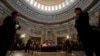 Guests pay their respects as the flag-draped casket of former President Jimmy Carter lies in state at the U.S. Capitol, in Washington, Jan. 8, 2025. Carter died Dec. 29 at the age of 100. 