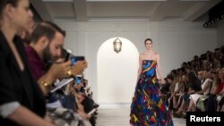 FILE - A model presents a creation from the Ralph Lauren Spring/Summer 2016 collection during New York Fashion Week in New York.