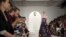 FILE - A model presents a creation from the Ralph Lauren Spring/Summer 2016 collection during New York Fashion Week in New York.
