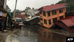 Apartments are destroyed following a landslide due to heavy rain in Harkhar, Chin State of Myanmar, July 30, 2015.