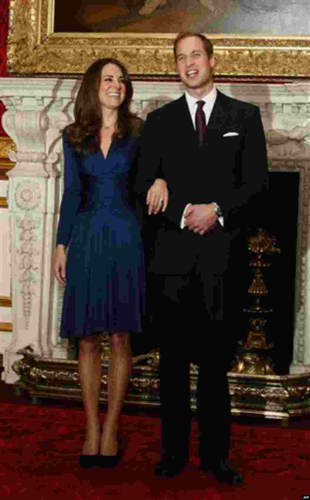 Britain's Prince William and his fiancee Kate Middleton pose for the media at St. James's Palace in London, Tuesday Nov. 16, 2010, after they announced their engagement. The couple are to wed in 2011. (AP Photo/Kirsty Wigglesworth)