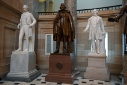 FILE - A statue of Jefferson Davis of Mississippi is on display in Statuary Hall on Capitol Hill in Washington, June 11, 2020.