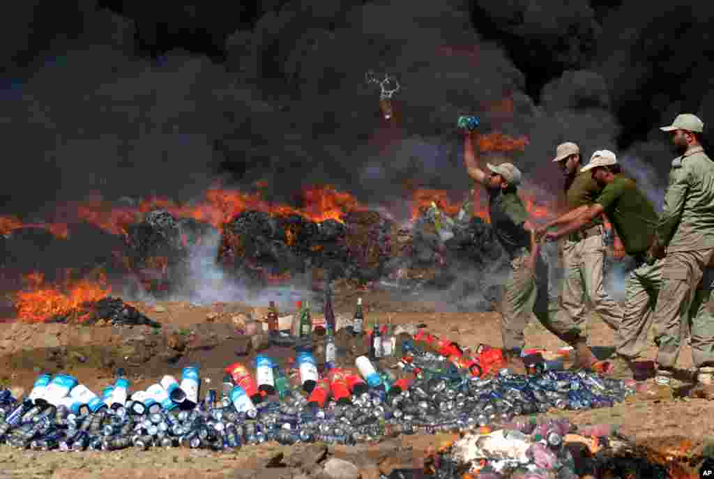 Pakistani officials of the Anti-Narcotic Control Force burn seized drugs and liquor in Peshawar. Pakistan is taking strict measures to stop drug trafficking from neighboring Afghanistan and Pakistani tribal areas.