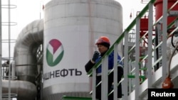 An employee talks on a portable radio set at Bashneft - Novoil refinery in the city of Ufa, Russia, April 11, 2013.