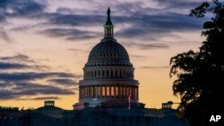 FILE - The Capitol is seen at dawn on the morning after Speaker Nancy Pelosi, D-Calif., announced the House of Representatives will vote on a resolution to affirm the impeachment investigation, in Washington, Oct. 29, 2019. 