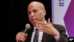 FILE - Democratic presidential candidate Sen. Cory Booker, D-N.J., answers questions during a presidential forum held by She The People on the Texas State University campus, April 24, 2019, in Houston.