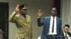 FILE: Police Commissioner General Godwin Matanga (left)