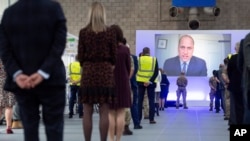 Britain's Prince William speaks via videolink as he officially opens the NHS Nightingale Hospital Birmingham, in the National Exhibition Centre (NEC), England, Thursday April 16, 2020. 