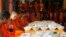 Local Buddhist monks prepare to eat food made by villagers and donated as offerings to the dead during celebrations of Pchum Ben, or Ancestors' Day, at a Buddhist pagoda of Wat Kanty Yaram, in Prek Thoang village, Kandal province, northeast of Phnom Penh, Cambodia Wednesday, Sept. 17, 2014. The traditional 15-day festival, which commemorates the spirits of the dead, began on Sept. 9. (AP Photo/Heng Sinith)
