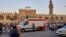 FILE - Ambulances wait to aid people who collapse from heat at Amr Ibn al-As mosque, in old Cairo, Egypt, May 31, 2019.