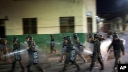 Military police patrols during government imposed dawn-to-dusk curfew in Tegucigalpa, Honduras, late Saturday, Dec. 2, 2017. The main opposition candidate called Saturday for Honduras' disputed presidential election to be held again after the country erupted in deadly protests over the delayed vote count. 