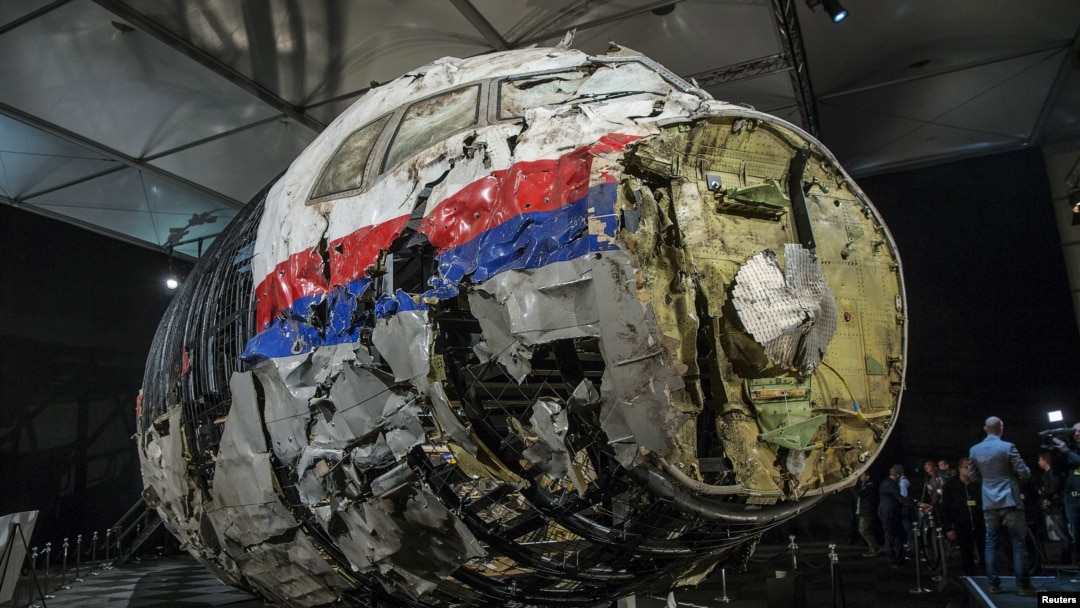 FILE - The reconstructed wreckage of the MH17 airplane is seen after the presentation of the final report on the crash in July 2014 of Malaysia Airlines flight MH17 over Ukraine, in Gilze Rijen, the Netherlands, Oct. 13, 2015. 