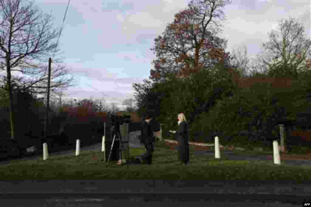 Members of the media report from outside Ellingham Hall, near Bungay, England, the home of journalist and Frontline Club founding member Vaughan Smith, Wednesday Dec. 15, 2010. WikiLeaks founder Julian Assange will reportedly stay at the house, located i