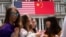 In this Thursday, Sept. 24, 2015, photo, China's flag is displayed next to the American flag on the side of the Old Executive Office Building on the White House complex in Washington.