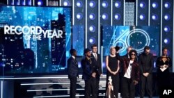 Bruno Mars accepts the award for record of the year for "24K Magic" at the 60th annual Grammy Awards at Madison Square Garden in New York, Jan. 28, 2018.