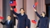 In this photo released by the Taiwan Presidential Office, Taiwan's President Lai Ching-te waves with the Taiwanese flag during a flag-raising ceremony in Taipei, Taiwan, Jan. 1, 2025. 