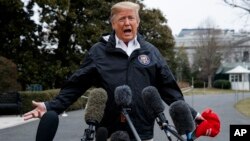 FILE - President Donald Trump talks with reporters outside the White House in Washington, March 8, 2019.