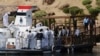 People carry the coffin of Aga Khan IV and 49th hereditary imam of Shiite Ismaili Muslims, who died Tuesday in Portugal, in Aswan, Egypt, Feb. 9, 2025.