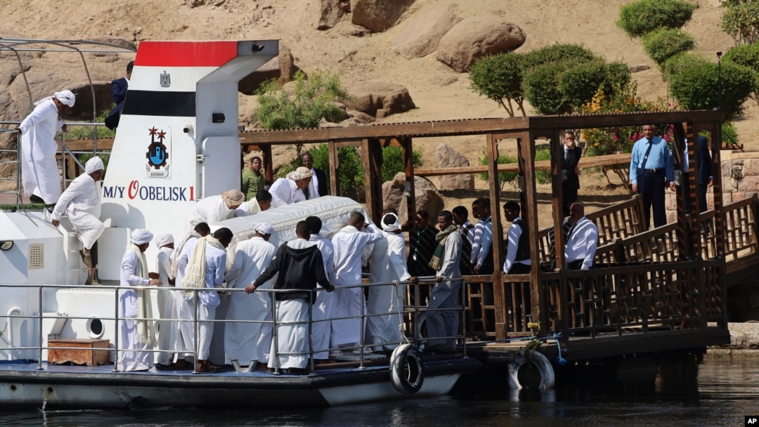People carry the coffin of Aga Khan IV and 49th hereditary imam of Shiite Ismaili Muslims, who died Tuesday in Portugal, in Aswan, Egypt, Feb. 9, 2025.