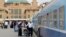 Passengers board train heading to Basra at rail station, Baghdad, May 6, 2013.