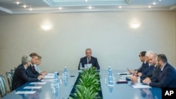 Moldova's President Igor Dodon, center, presides over the country's Supreme Security Council in Chisinau, Moldova, Tuesday, June 11, 2019.