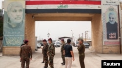 نیروهای امنیتی عراق در سمت عراقی گذرگاه شلمچه، ساعاتی پس از حمله به بخش ایرانی پایانه تجاری شلمچه