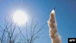 (FILE) Image from North Korea's official Korean Central News Agency showing a new-type anti-aircraft missile test-fire in the West Sea of Korea.
