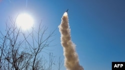 TOPSHOT - This picture taken on Feb. 2, 2024, and released from North Korea's official Korean Central News Agency (KCNA) on Feb. 3, 2024, shows an anti-aircraft missile test-fire in the West Sea of Korea.