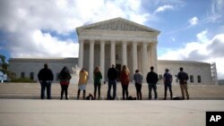 FILE - Members of a group called "Bound 4 Life" gather in front of the Supreme Court in Washington to protest the ideology of abortion, Oct. 5, 2015.