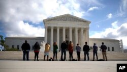 FILE - The Obama administration asked the U.S. Supreme Court to rule on a controversial Texas abortion law. Here, a group gathers Oct. 5, 2015, in front of the courthouse to weigh in on abortion.