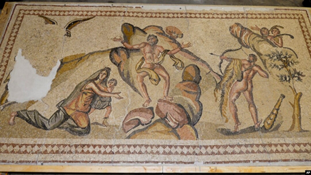 This undated photo provided by the U.S Department of Justice shows an ancient mosaic believed to have been looted from war-torn Syria and illegally imported into the United States. 