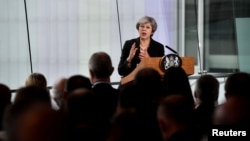 Britain's Prime Minister Theresa May delivers a speech at the Waterfront Hall in Belfast, Northern Ireland, July 20, 2018.