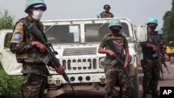 In this image taken from video, United Nations peacekeepers guard the area where a U.N. convoy was attacked and the Italian ambassador to Congo killed, in Nyiragongo, North Kivu province, Congo, Feb. 22, 2021. 