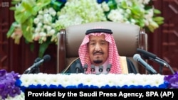 Saudi King Salman gives his annual policy speech in the ornate hall of the consultative Shura Council, Nov. 19, 2018, Riyadh, Saudi Arabia. 