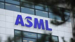 FILE - The ASML Holding logo is seen at the company's headquarters in Eindhoven, Netherlands, Jan. 23, 2019.