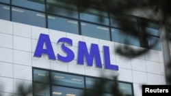 FILE - The ASML Holding logo is seen at the company's headquarters in Eindhoven, Netherlands, Jan. 23, 2019.