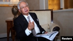 Malaysia's Prime Minister Najib Razak speaks to Reuters during the 10th World Islamic Economic Forum in Dubai Oct. 28, 2014.