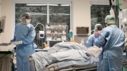 FILE - An intubated COVID-19 patient gets treatment at the intensive care unit at the Westerstede Clinical Center, a military-civilian hospital in Westerstede, northwest Germany, Dec. 17, 2021.